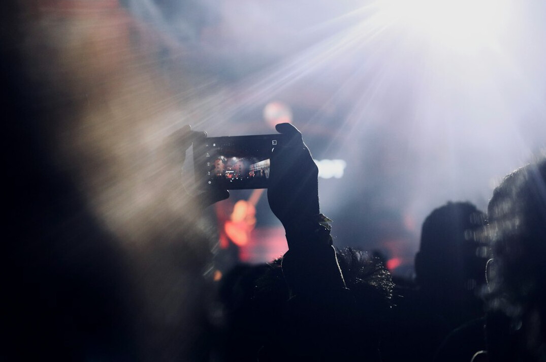 Camera operator filming a live event